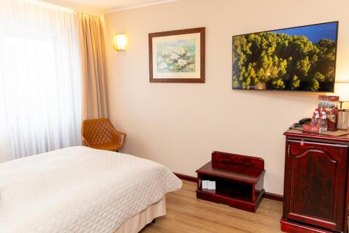Cama o camas de una habitación en Hotel Legend