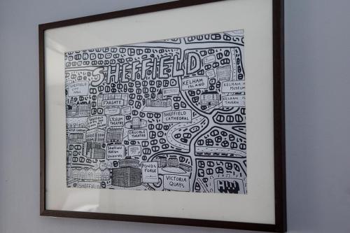 a framed drawing of a city at Modern Cozy Retreat-Family-Friendly-Near City & Peak District in Sheffield