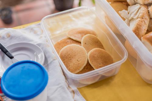 a plastic container of bagels sitting on a table at Pousada Gincoara in Jijoca de Jericoacoara