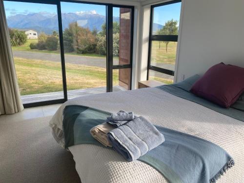 Ένα ή περισσότερα κρεβάτια σε δωμάτιο στο Cosy Retreat