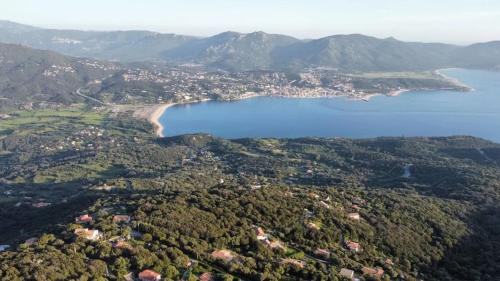 an aerial view of a city and a body of water at Maison charmante avec vue sur la mer, Olmeto + Cheminée in Olmeto