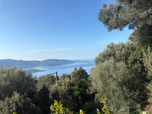 a view of the ocean from a hillside at Maison charmante avec vue sur la mer, Olmeto + Cheminée in Olmeto