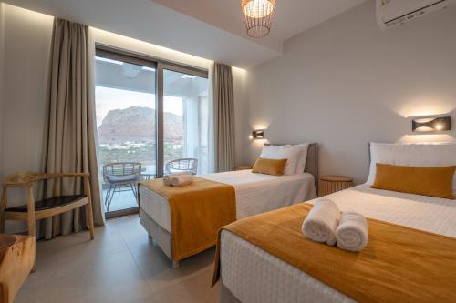 Ένα ή περισσότερα κρεβάτια σε δωμάτιο στο Joy's Villas