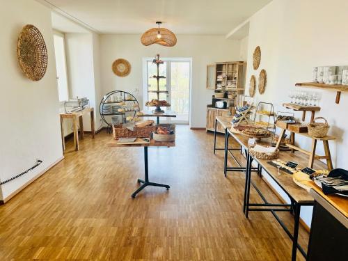 a room filled with lots of items on display at Hôtel Domaine de la Sauge in Cudrefin
