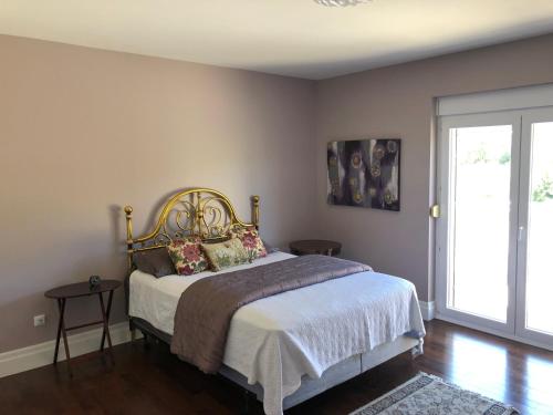 a bedroom with a bed with a white bedspread at Villa Bonaca in Mrljane