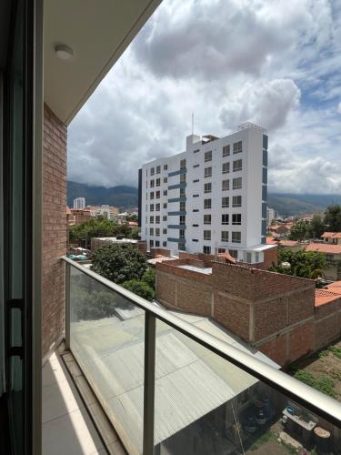a balcony with a view of a building at Monoambiente in Cochabamba