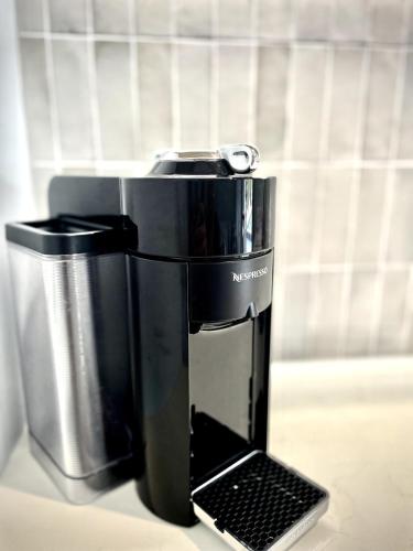 a coffee maker sitting on top of a counter at Newly Renovated, walk to beach, jump in pool in Gold Coast
