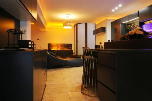 a living room with a bar and a fireplace at OLGA Luxury Suite I 5 min from airport I central location I traditional village in Luqa