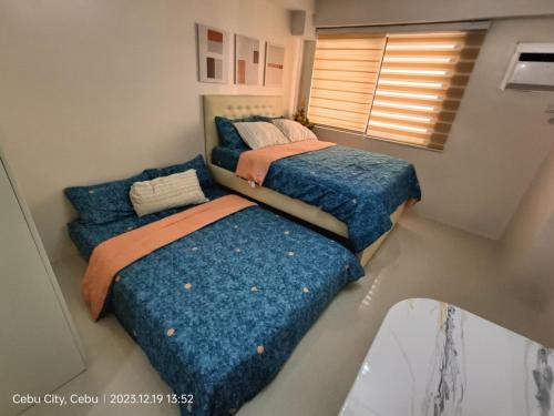 Postel nebo postele na pokoji v ubytování Happy Homes Fully Furnish Condo Unit - Persimmon