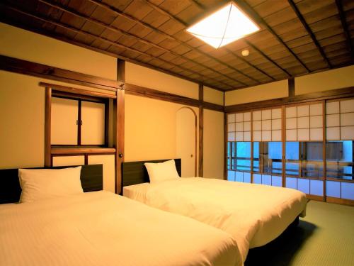 箱根小涌園 三河屋旅館にあるベッド