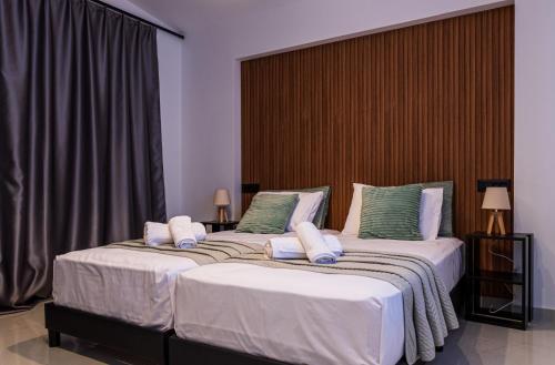 two beds in a hotel room with two bedsskirts at Anna Maria's Maisonette II in Kardamaina