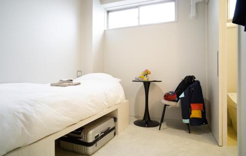 Ένα ή περισσότερα κρεβάτια σε δωμάτιο στο Hostel Casa Noda