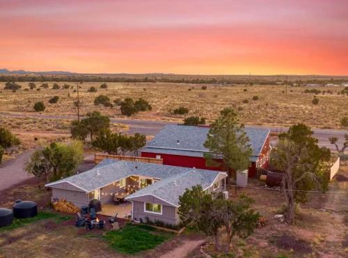an aerial view of a house in the middle of a field at 25 Min to Grand Canyon Shuffleboard Fire Pit in Valle