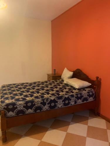 Una cama o camas en una habitación de Surinam house
