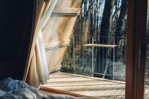 a room with a wooden porch with a window at SANU 2nd Home 那須2nd in Nasu