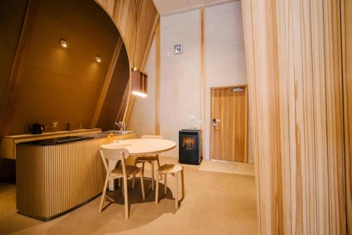 a kitchen with a table and chairs in a room at SANU 2nd Home 那須2nd in Nasu