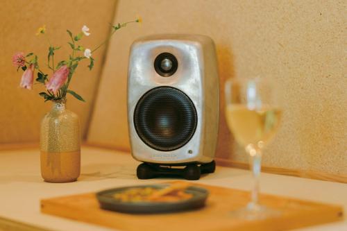 a small speaker sitting on a table next to a wine glass at SANU 2nd Home 那須2nd in Nasu