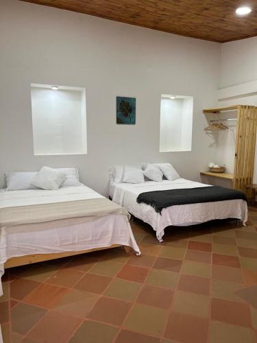 Ένα ή περισσότερα κρεβάτια σε δωμάτιο στο Casa campestre Villa Transito