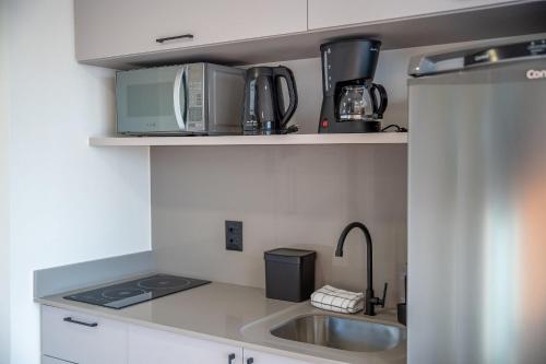 Dapur atau dapur kecil di EDIFICIO UP - Loft próximo a Vila Germânica e FURB com vaga.