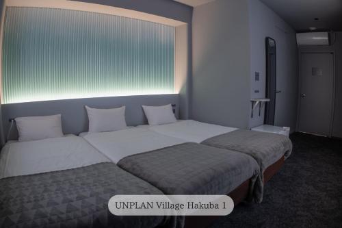 UNPLAN Village Hakubaにあるベッド