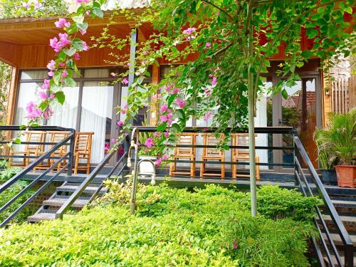a building with a bunch of flowers on it at Tam Coc Sunshine Homestay in Ninh Binh