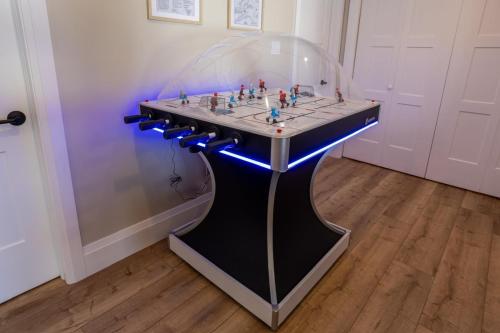 a glass table with a chess set on top of it at Algonquin Park,Sunset Paradise with Private Beach in Madawaska