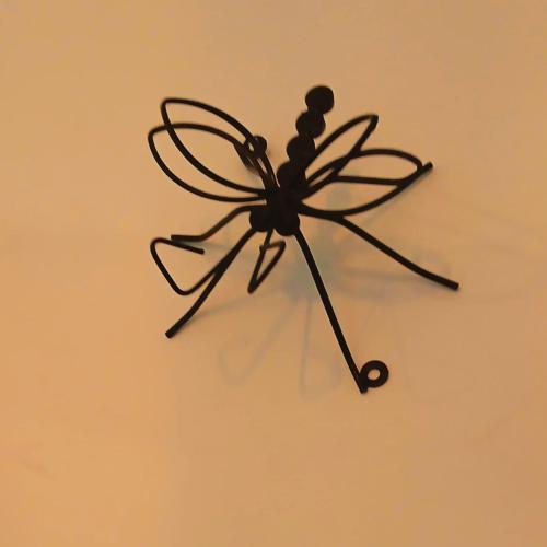a small black clock on a wall at Mountain-View Retreat Close to Ella in Badulla
