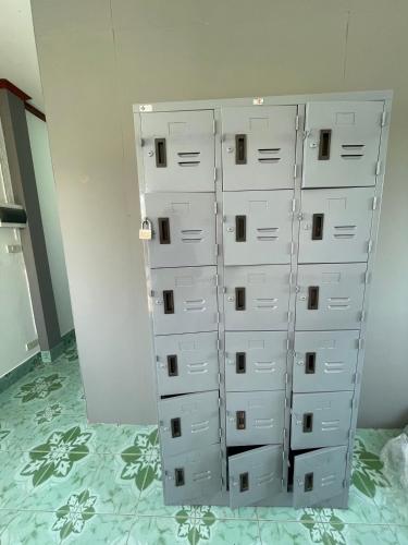 a group of white drawers in a wall at Lanta Corsica Hostel in Ko Lanta Yai