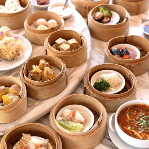 a bunch of bowls of food on a table at Avani Khon Kaen Hotel & Convention Centre in Khon Kaen