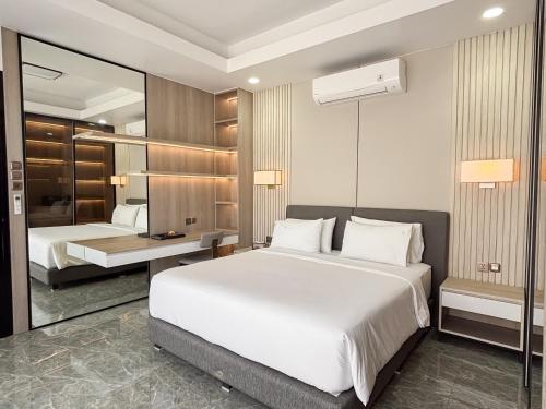 Ένα ή περισσότερα κρεβάτια σε δωμάτιο στο Bellagio Villas