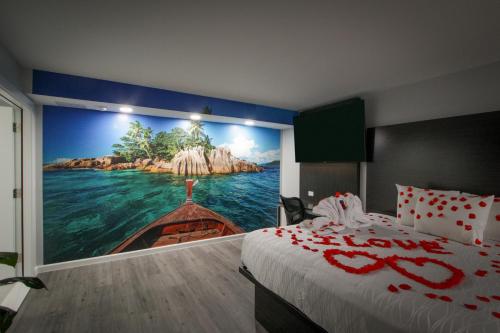 a bedroom with a mural of a boat in the water at Envi Boutique Hotel Henderson-Evansville South in Henderson