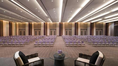 a large room with rows of chairs in it at Avani Khon Kaen Hotel & Convention Centre in Khon Kaen