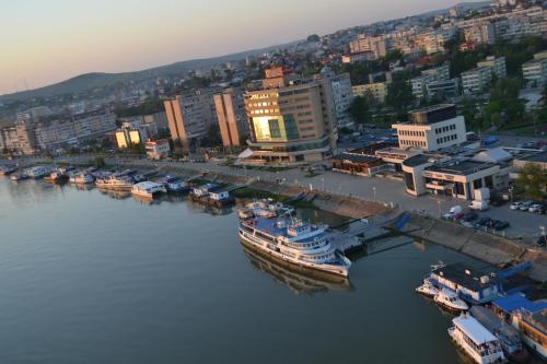 a large boat is docked in a harbor at Hotel Esplanada in Tulcea