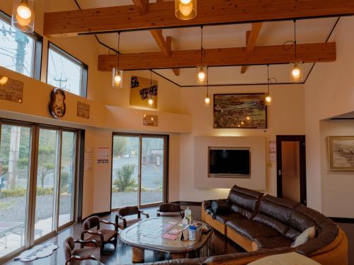 a living room with a couch and a table at Ikinomannaka - Vacation STAY 58080v in Iki