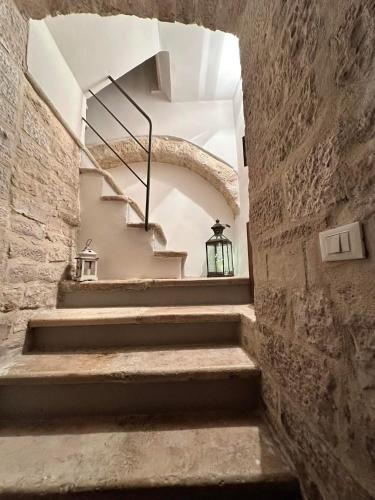 a staircase in a stone building with a stair case at Depandance sul porto in Molfetta