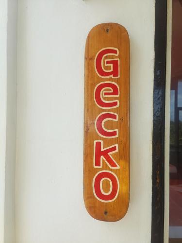 a wooden sign hanging on a wall at Casa de Arte in Boracay