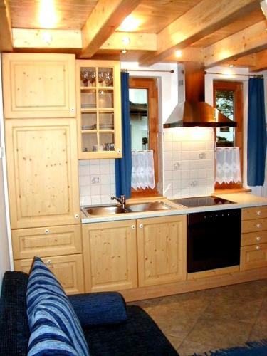 a kitchen with a sink and a stove at Alpencamp Kärnten in Kötschach