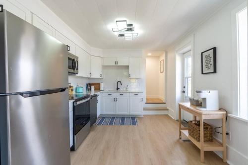 a large kitchen with a stainless steel refrigerator at Grand Bend 5BR Retreat Hot Tub, Fire Pit and BBQ in Grand Bend