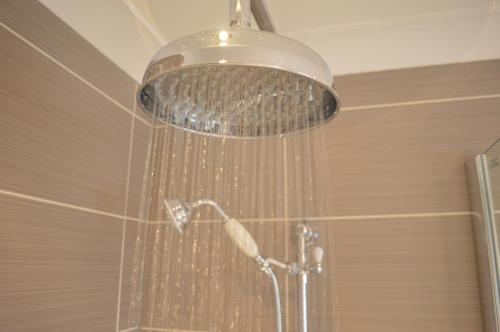 a shower with a shower head in a bathroom at The Tide in Dunvegan