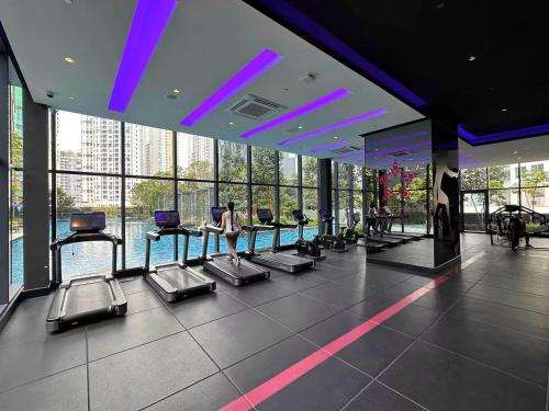 a gym with rows of cardio machines in a building at Star Residences KLCC in Kuala Lumpur