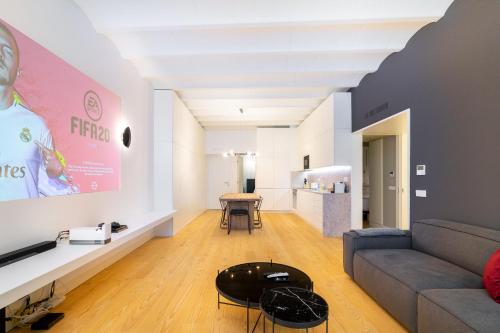 a living room with a couch and a table at WHome | LS48 Prime Location Upscale Family Apartment in Lisbon