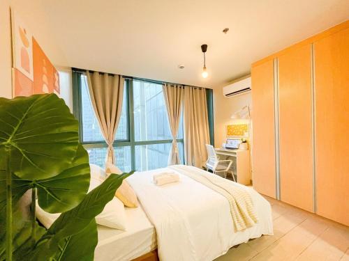a bedroom with a bed and a large window at Prime BGC Condo: Uptown Mall & Hyatt #ournw21n in Manila