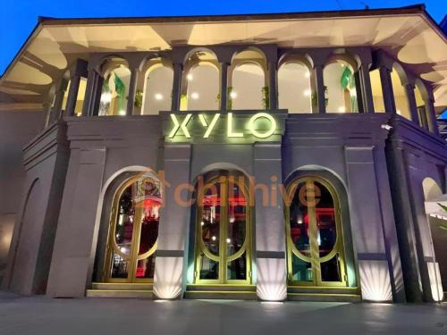 a building with a xxxico sign on the front of it at 1BR Condo, BGC Uptown Mall, Grand Hyatt #ournw20j in Manila
