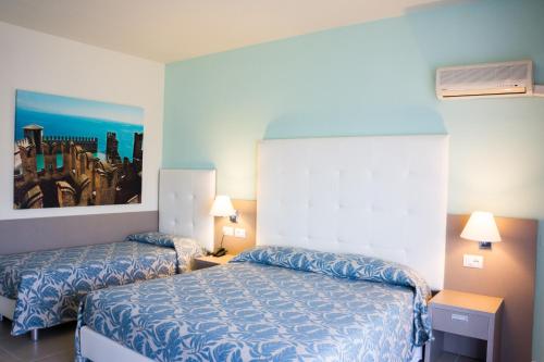 Postel nebo postele na pokoji v ubytování Hotel Residence Holiday