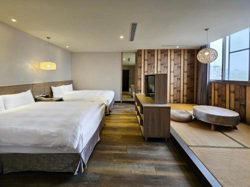 Postel nebo postele na pokoji v ubytování Herb Art Hotel