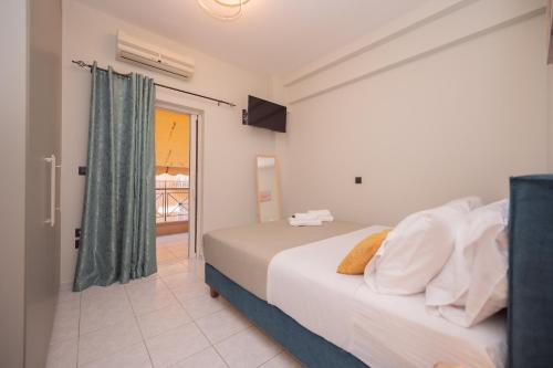 Ένα ή περισσότερα κρεβάτια σε δωμάτιο στο Cozy Stay Preveza