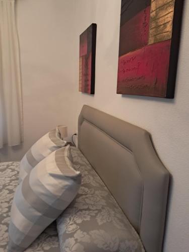 a bed with two pillows on it in a room at Casa Javi in Ojedo