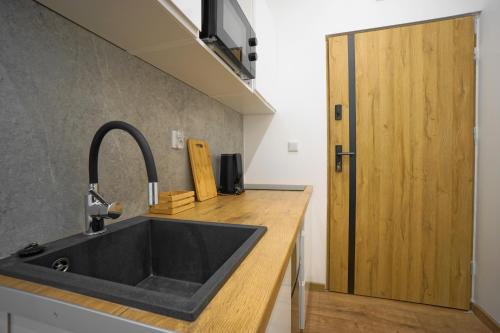 Kuchyň nebo kuchyňský kout v ubytování K'59 Prestige Apartments