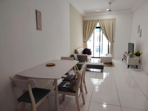 a white living room with a table and chairs at Paradigm Mall Platino Apartment 2BR 2FREE By Natol in Johor Bahru