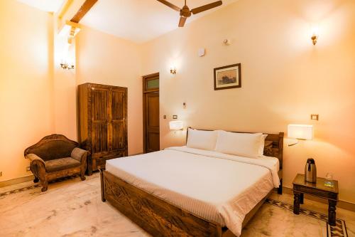 Ένα ή περισσότερα κρεβάτια σε δωμάτιο στο Club Mahindra Bharatpur